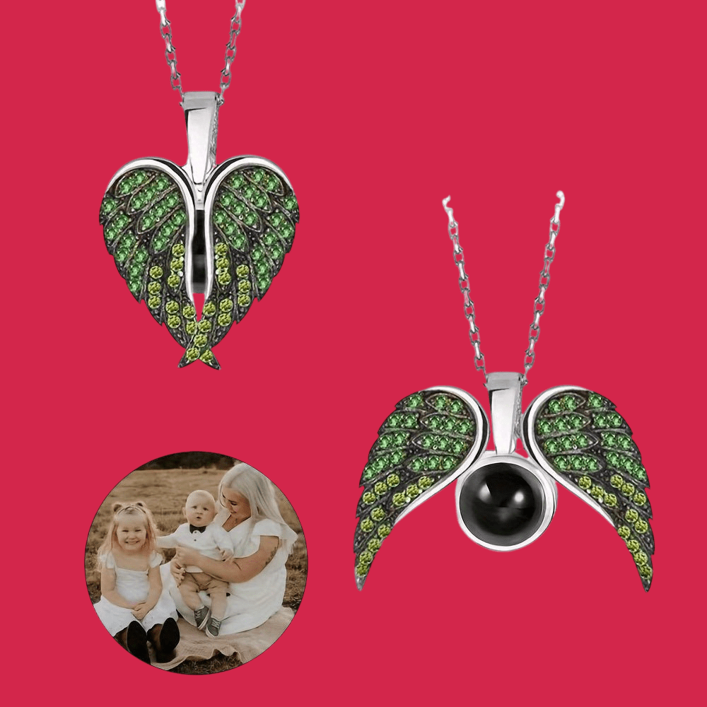 Two heart-shaped pendants with green gemstones on a red background, one featuring a black stone.